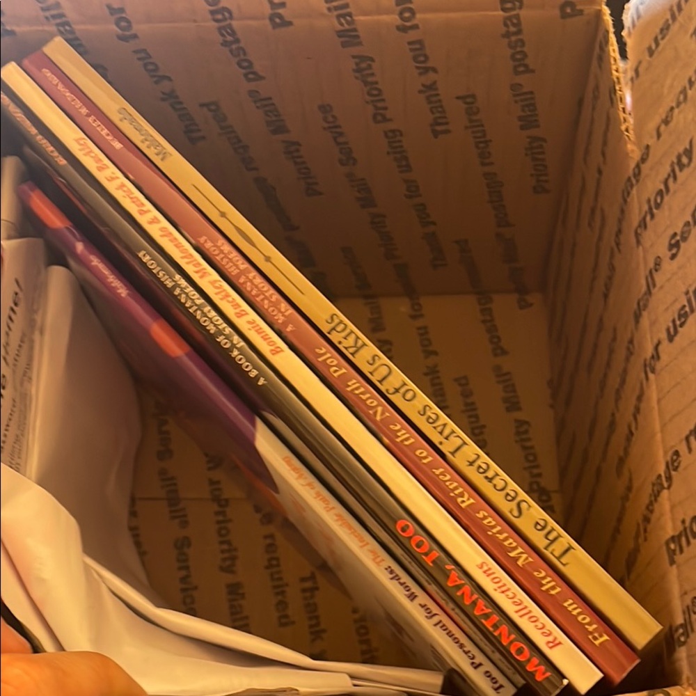 Assortment of books clothes and phone cases